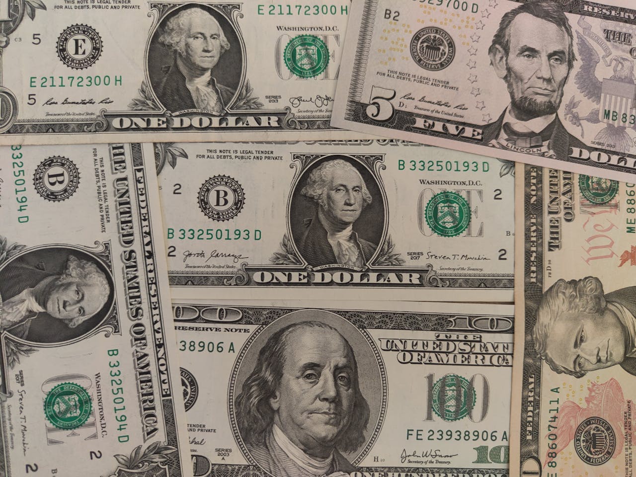 Offerings Close-up image showing a mix of U.S. dollar bills including , , and 0 bills.